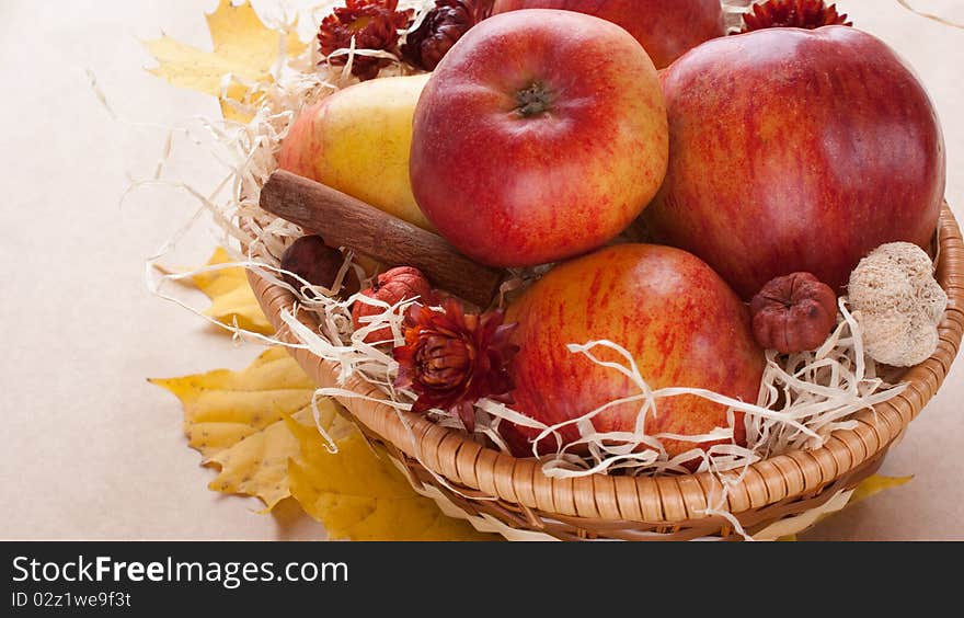 Apples in a wicker basket on table. Apples in a wicker basket on table