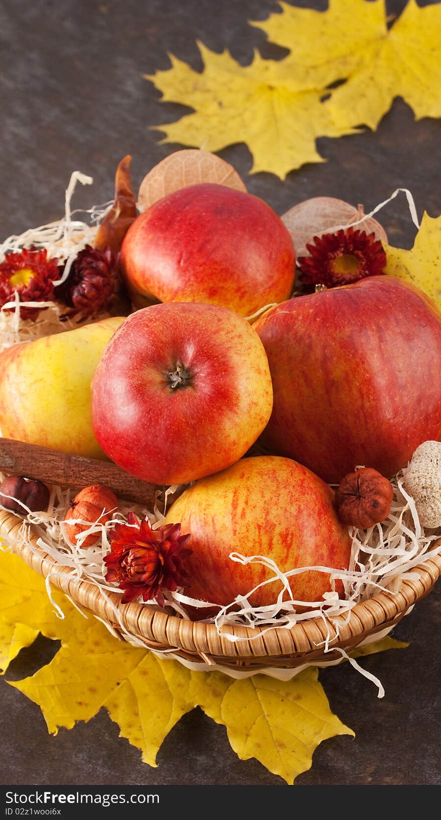 Apples in a wicker basket on table. Apples in a wicker basket on table