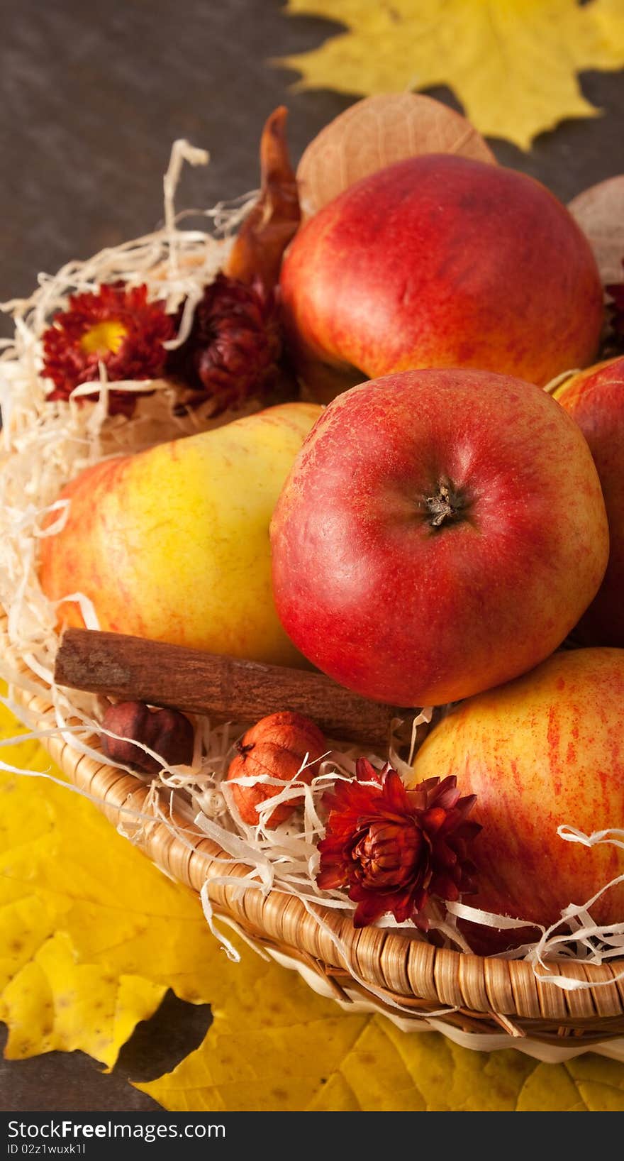 Apples in a wicker basket on table. Apples in a wicker basket on table