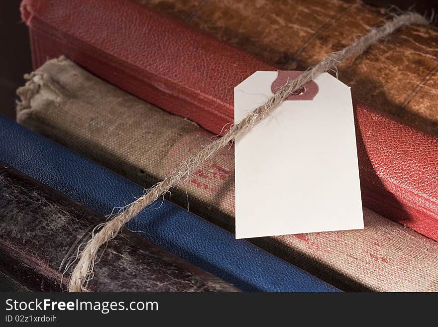 Archival documents in a book-depository are tied up by a cord. Archival documents in a book-depository are tied up by a cord.