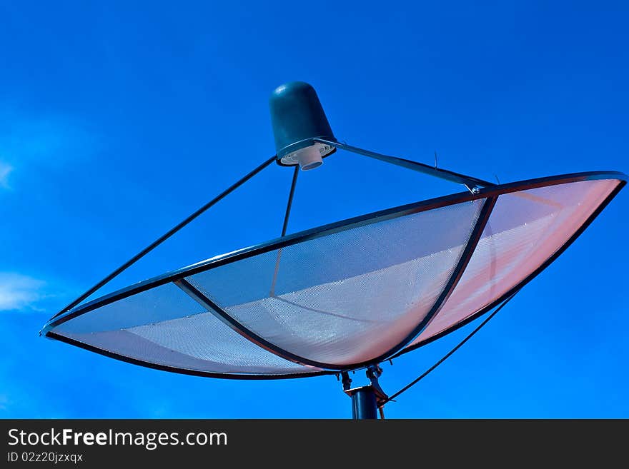 Satellite dish in blue sky