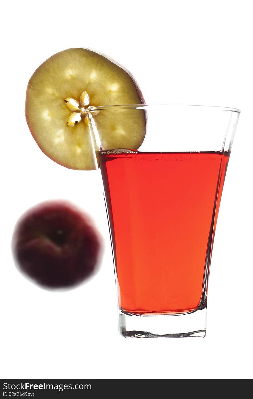 Glass of freshly squeeze red apple juice