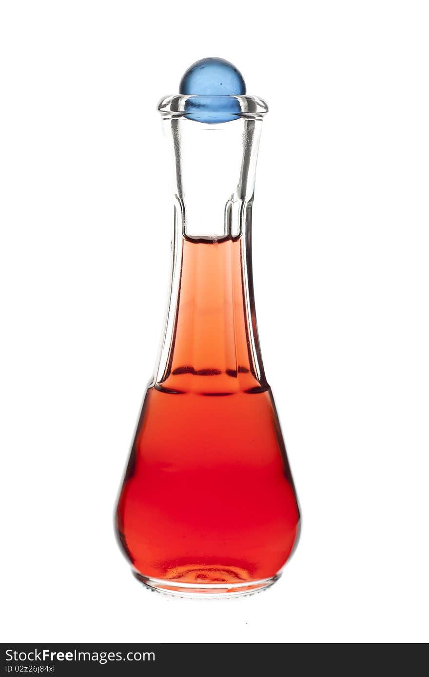 Laboratory glassware filled with a red liquid