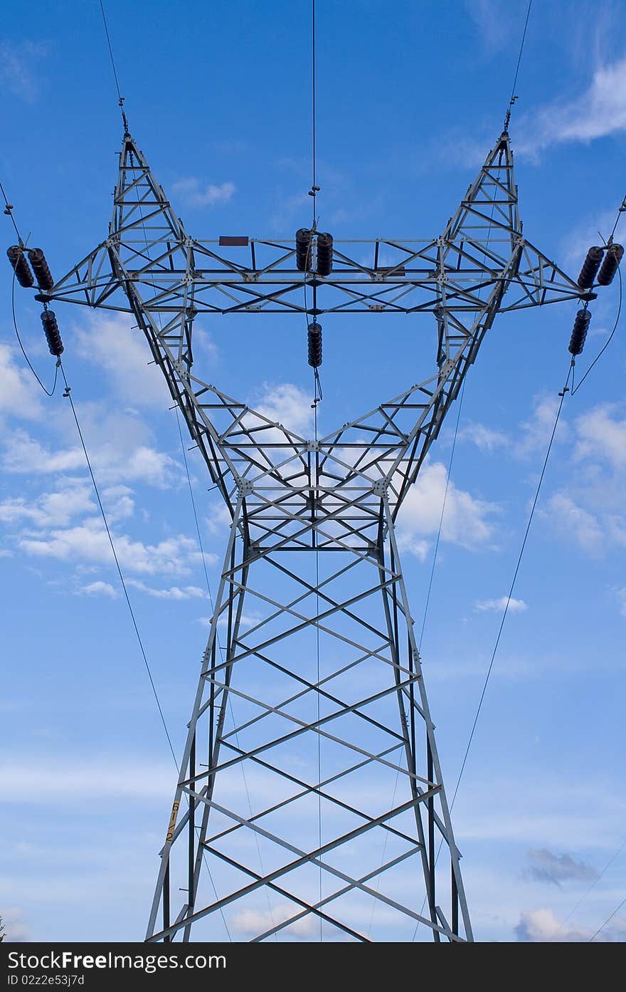 Power plant and power lines in blue sky