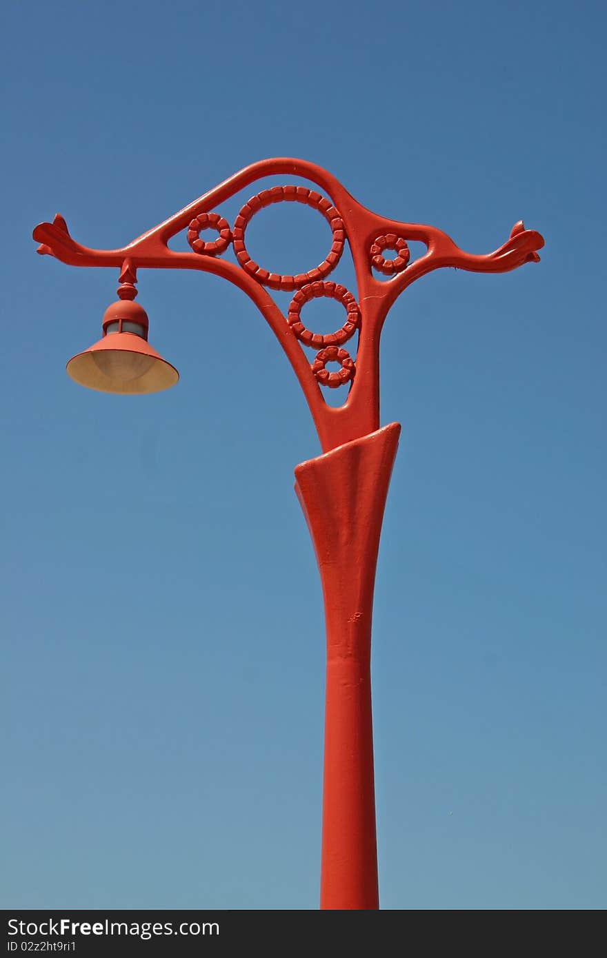 Isolated vintage streetlamp on a blue sky