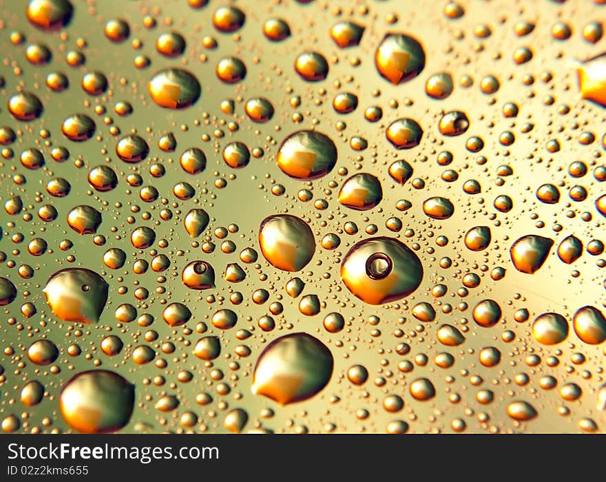 Background of blue and yellow-colored droplets. Background of blue and yellow-colored droplets