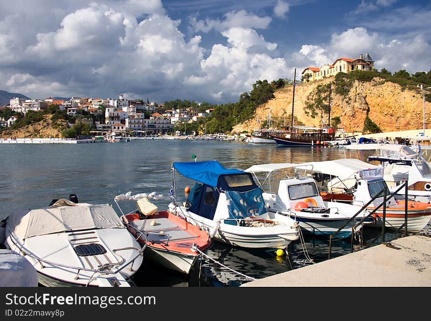 Boats And Castle In A Port In Greece