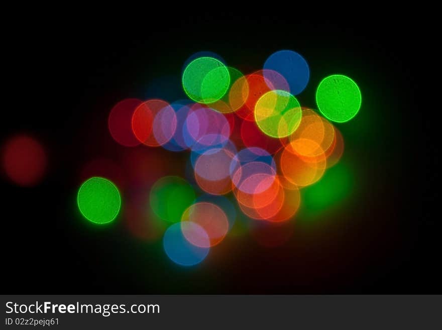 Multi-colored Christmas lights on a black background. Multi-colored Christmas lights on a black background