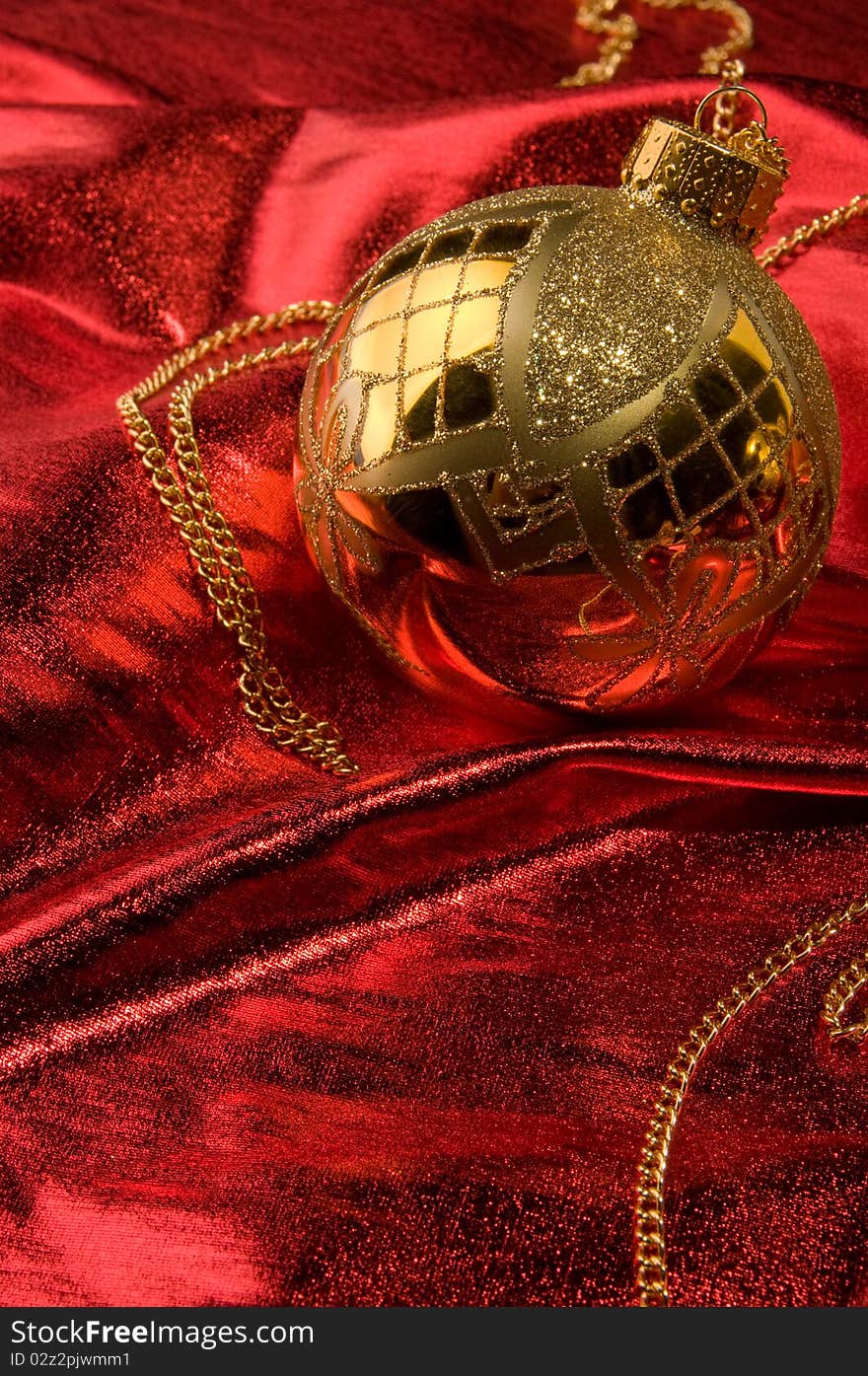 Gold baubles with red backdrop