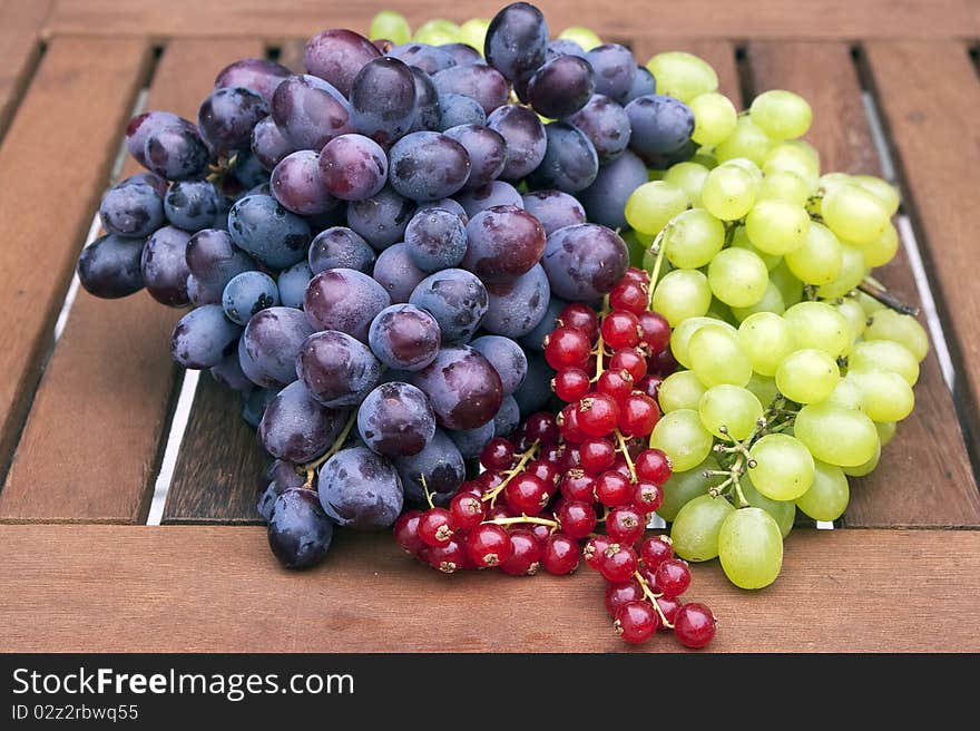 Pigeons and currant wine on a table. Pigeons and currant wine on a table