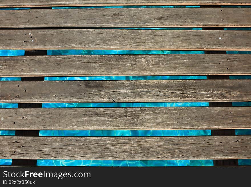 The wooden bridge in a swimming pool. The wooden bridge in a swimming pool