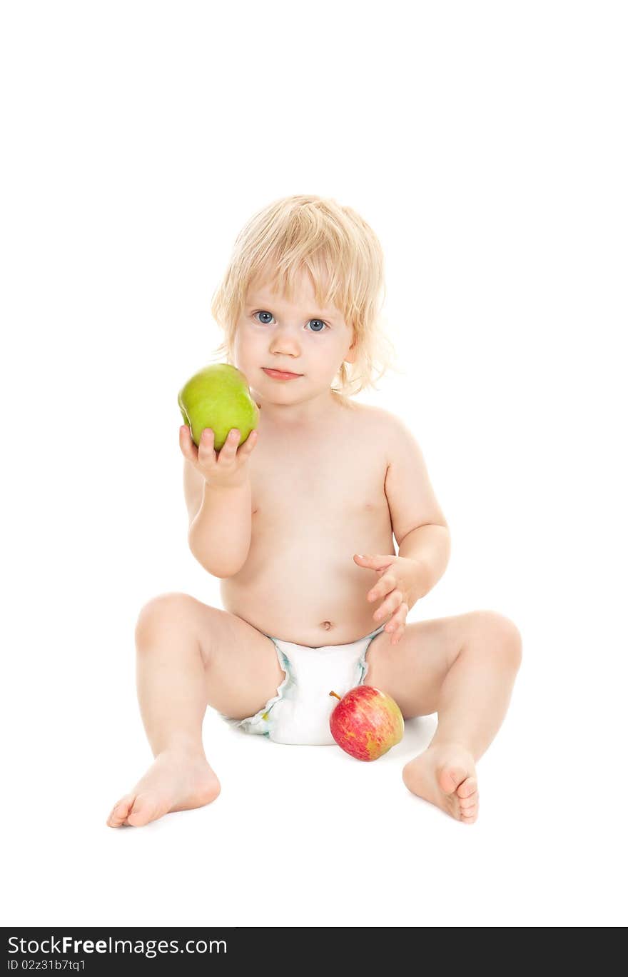 Sweet baby girl holding a green apple isolated on white