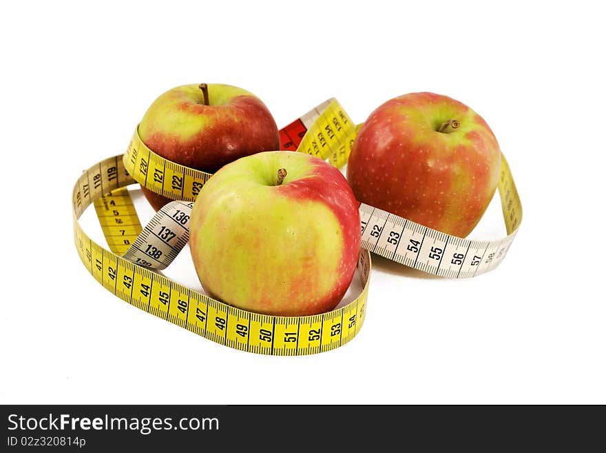 Apples with measuring tape isolated on white background