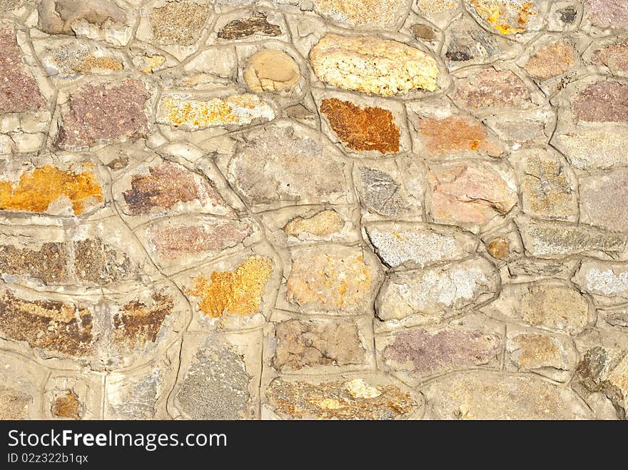 A large wall made of stones. A large wall made of stones