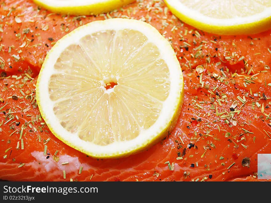 Salmon with lemon food background closeup shoot.