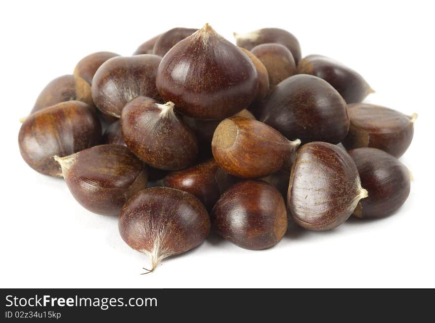 Heap of chestnuts isolated over white background. Heap of chestnuts isolated over white background