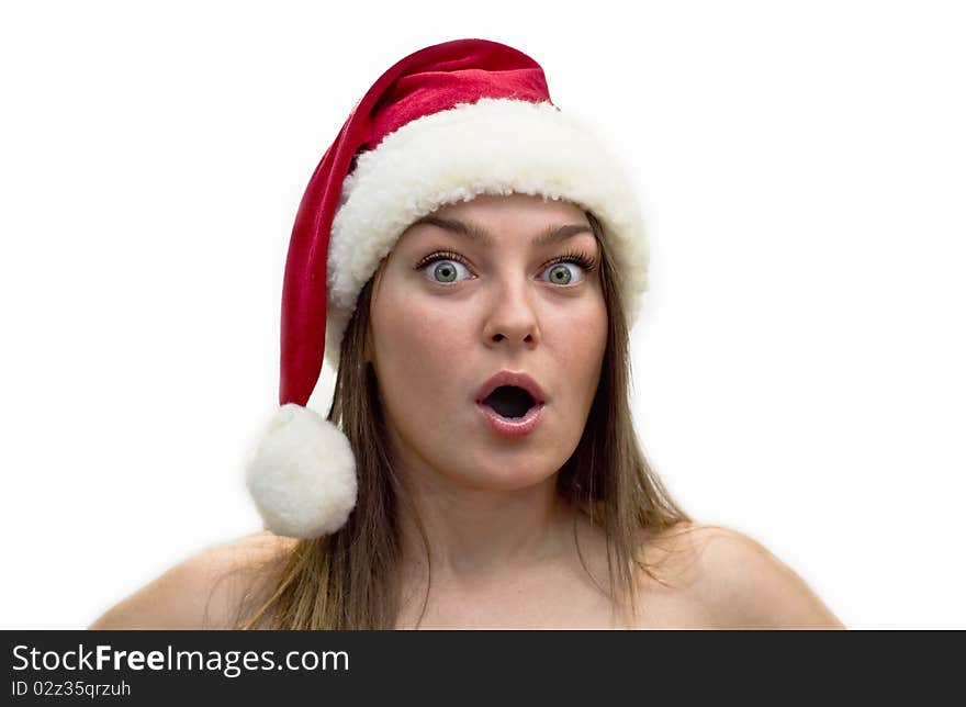 Surprised young women in a Santa Claus hat. Studio shot, isolation on a white background