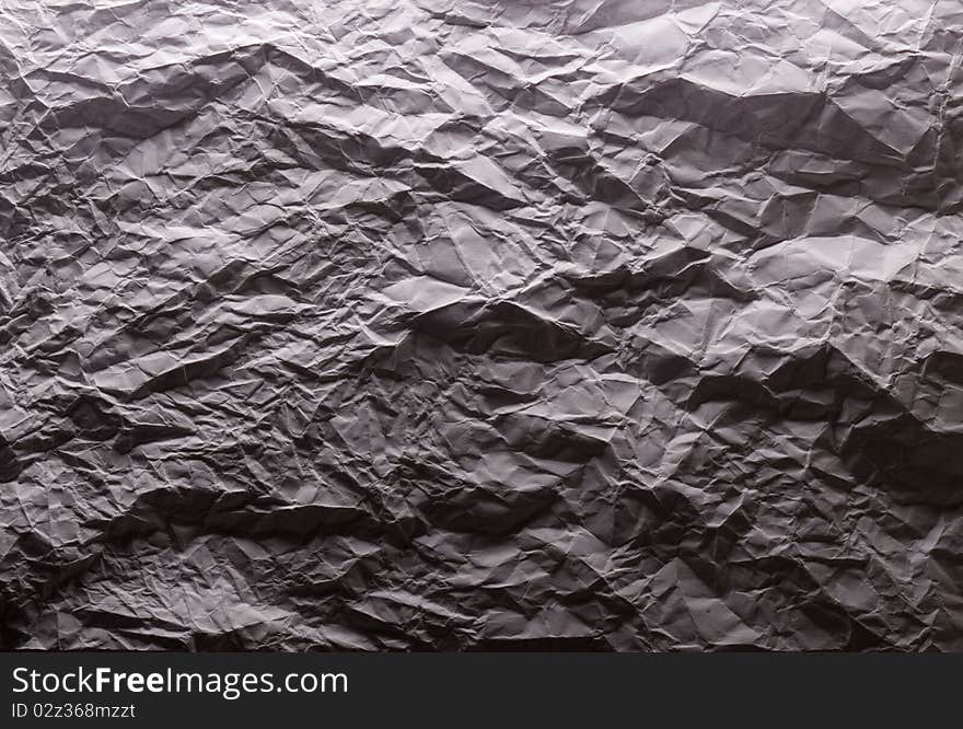 Crushed white paper in dark light Hard texture