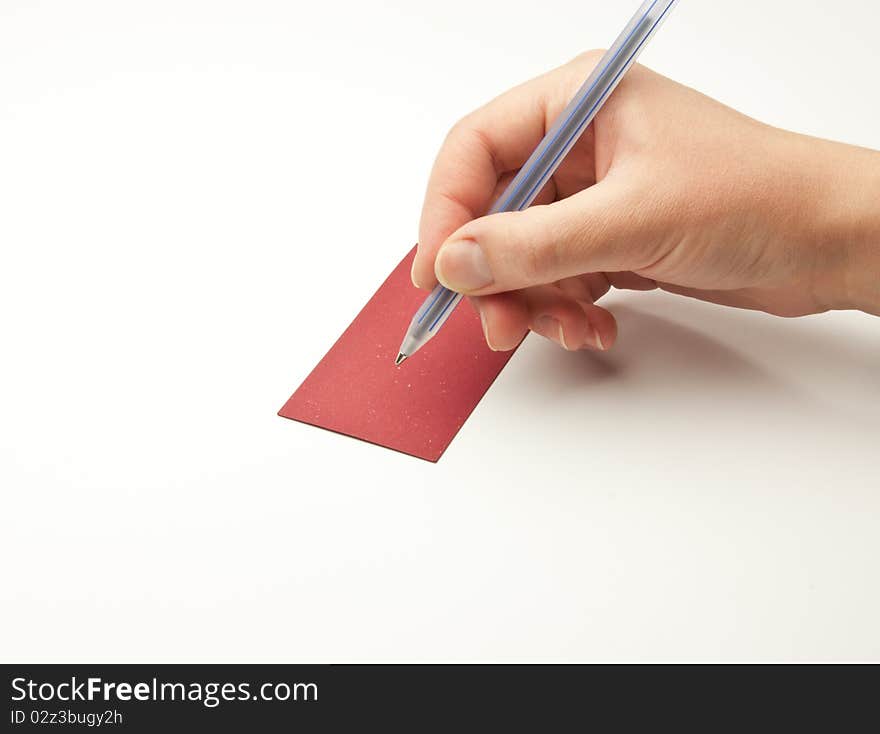 Hand holding pen isolated on white background