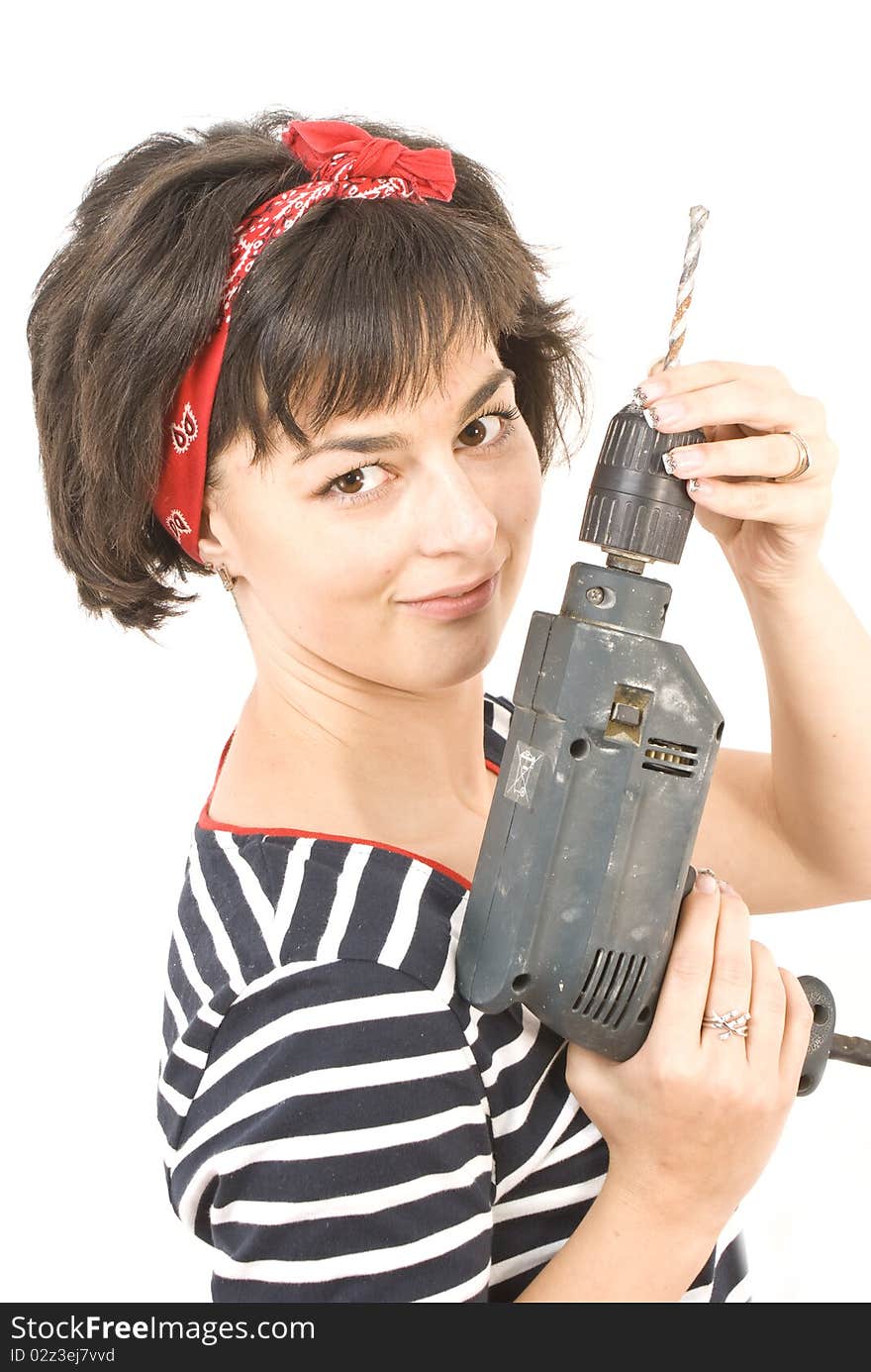 Attractive young lady worker with a pneumatic drilling machine isolated on white