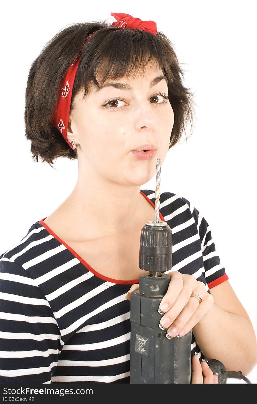 Attractive young lady worker with a pneumatic drilling machine isolated on white