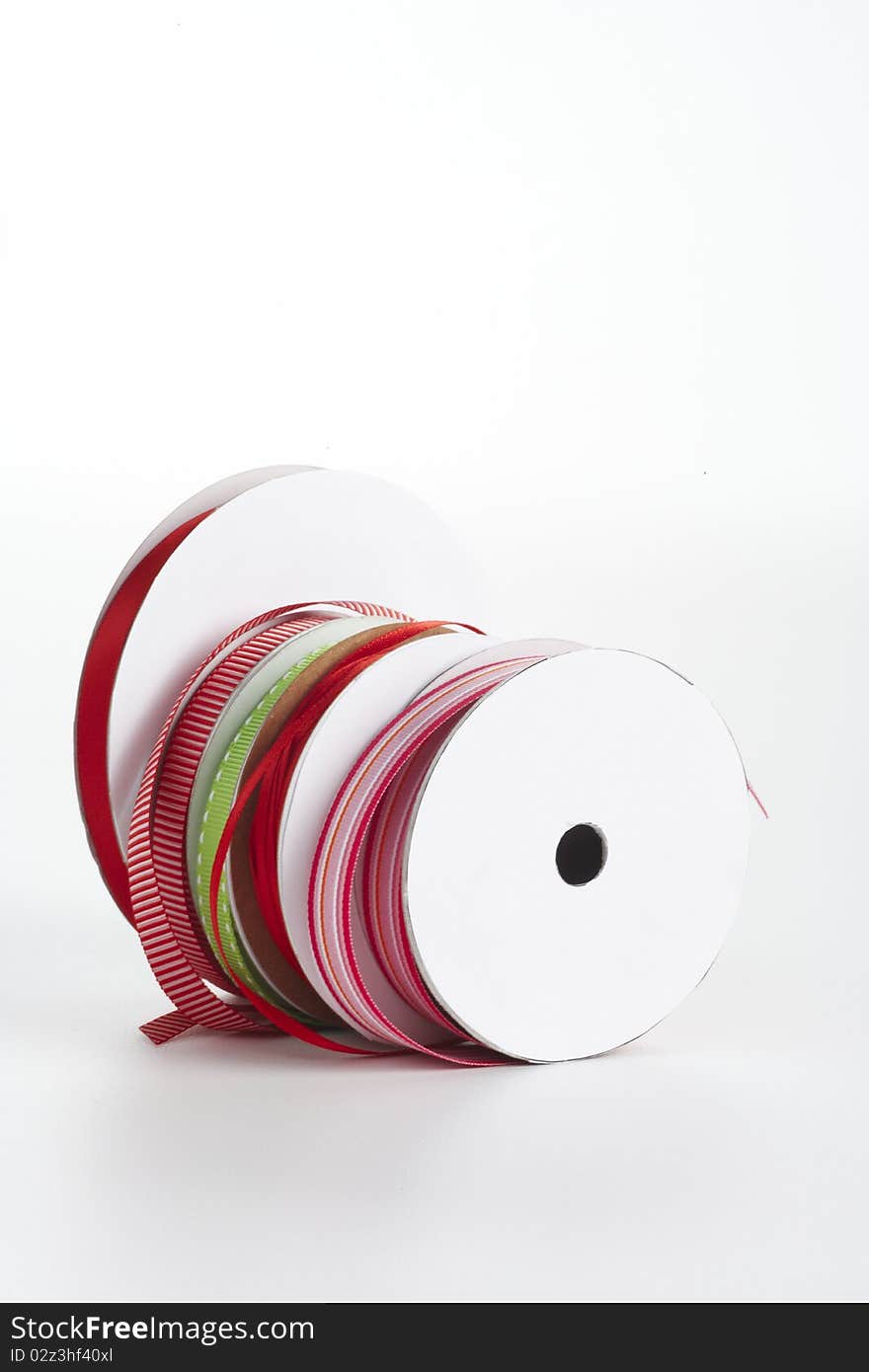 Five spools of ribbon in a row