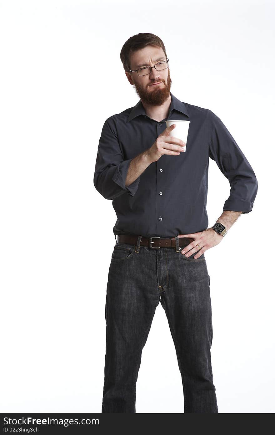 Man in casual wear holding a paper coffee cup points to someone off camera. Man in casual wear holding a paper coffee cup points to someone off camera