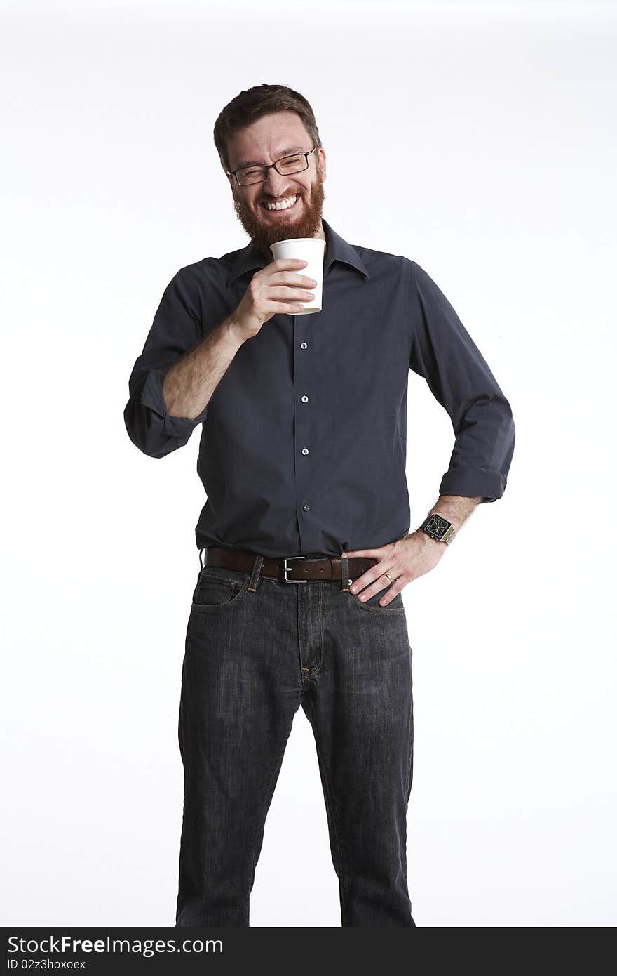 Man holding a paper coffee cup with big laugh on his face