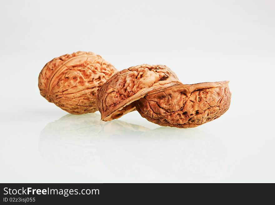 Organic walnuts isolated on white background.