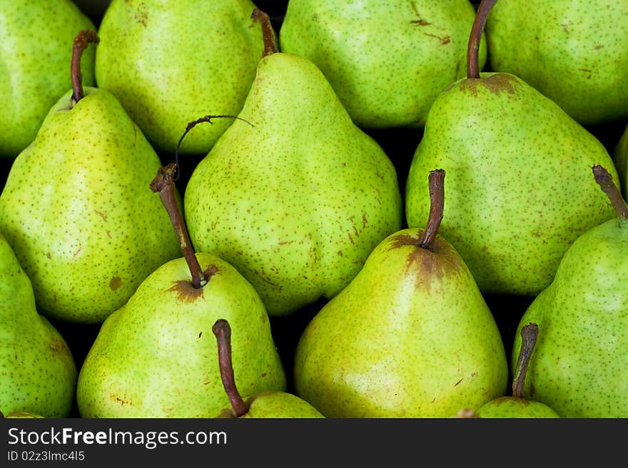 Green pear background at the market