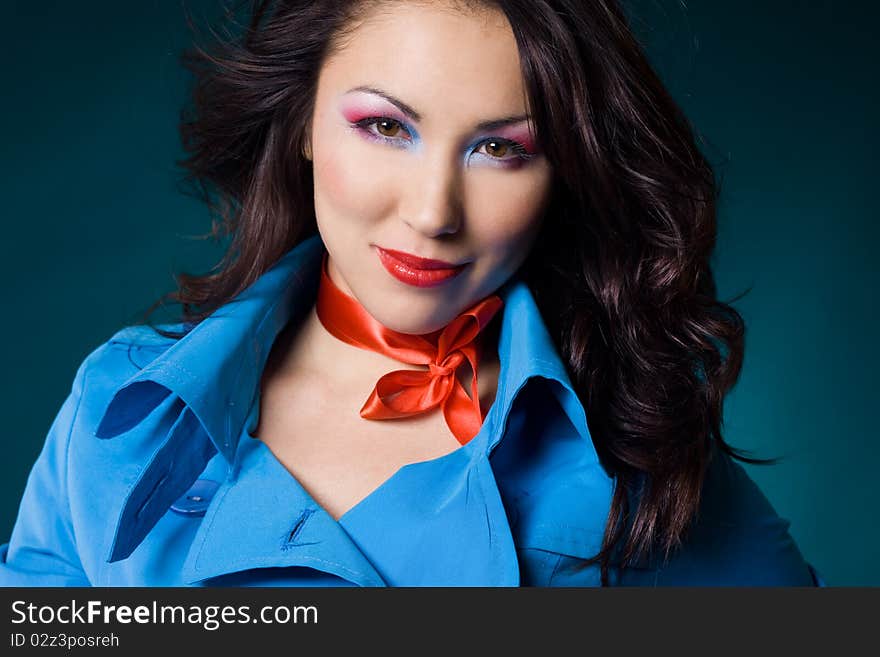 Elegant fashionable woman in blue jacket