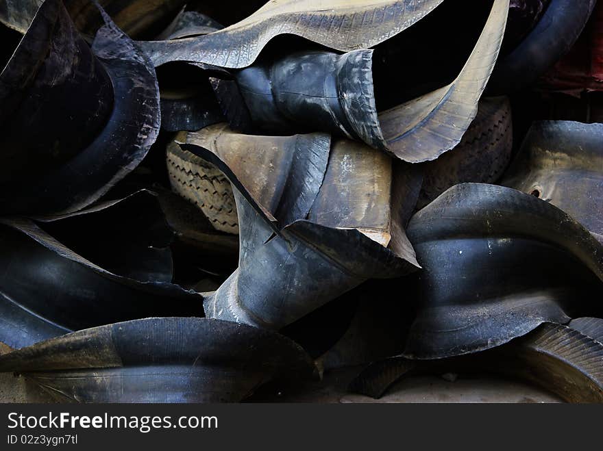 Abandoned black tires in a salvage station. Abandoned black tires in a salvage station