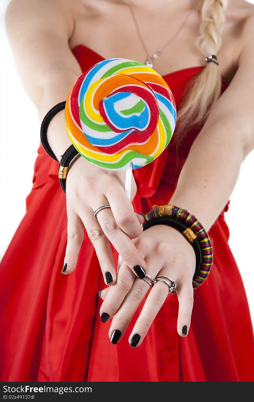 Young girl is holding a lollypop