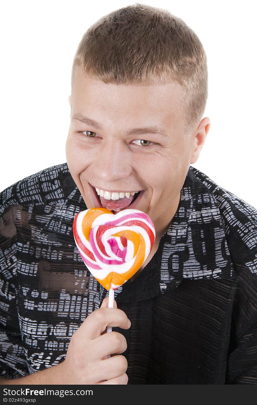 Young man is going to eat a lollypop