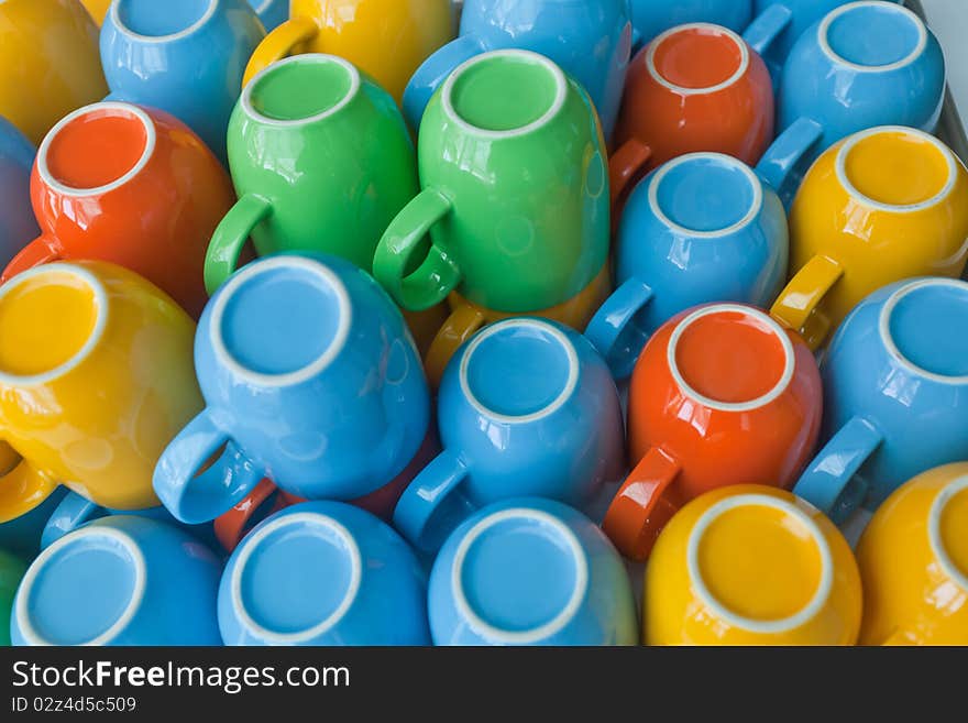 Colorful cups stacking on table. Colorful cups stacking on table