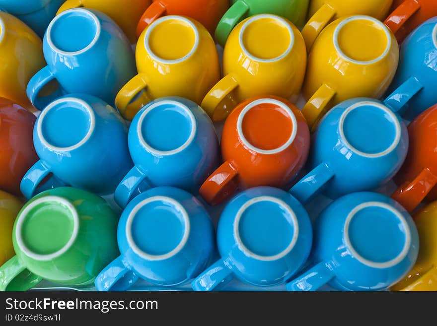 Colorful cups stacking on table. Colorful cups stacking on table