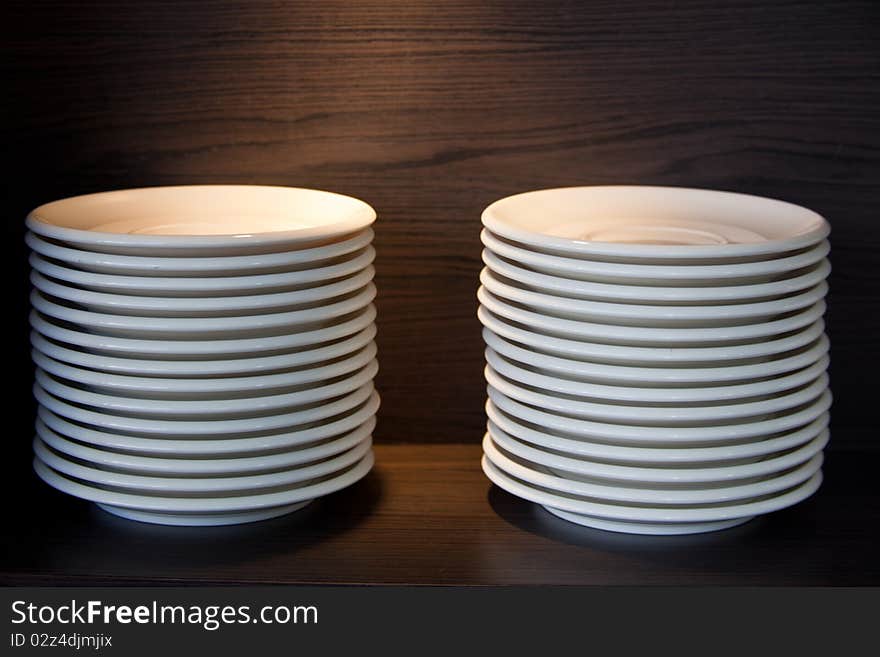 White plate stacking on the shelve. White plate stacking on the shelve