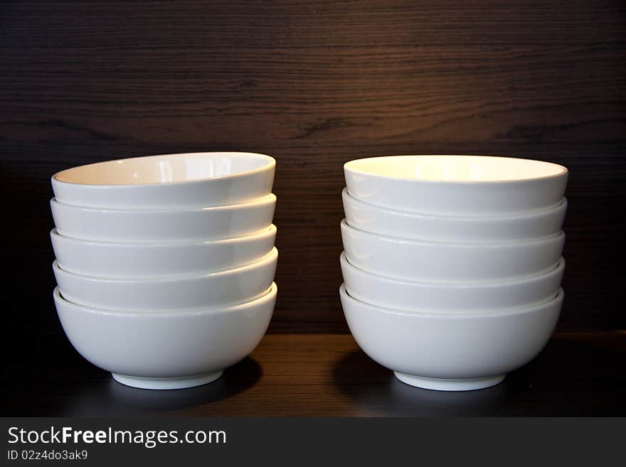 White bowls stacking on the shelve. White bowls stacking on the shelve