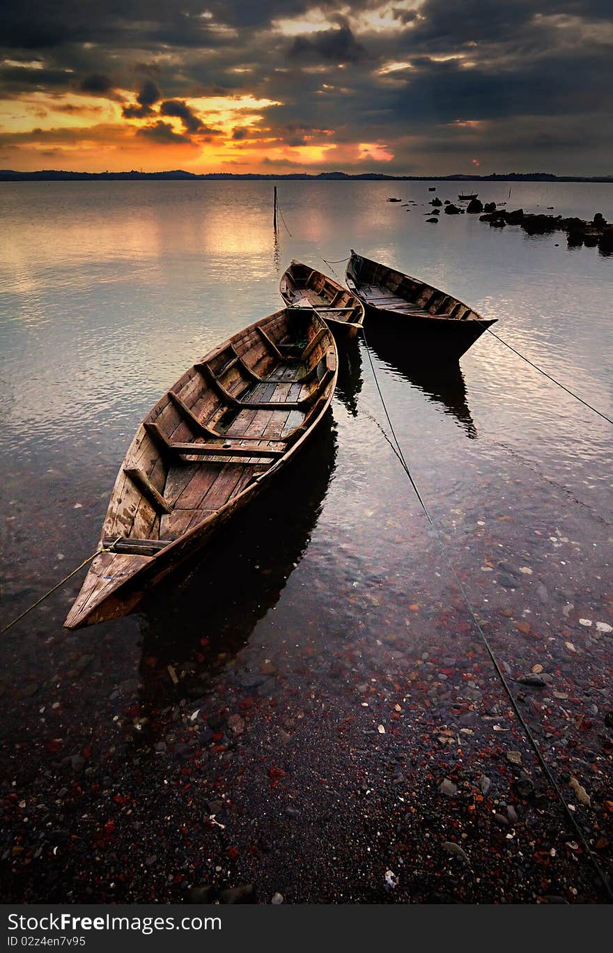 Tree boat in sunrise, boat transports for fishing. Tree boat in sunrise, boat transports for fishing