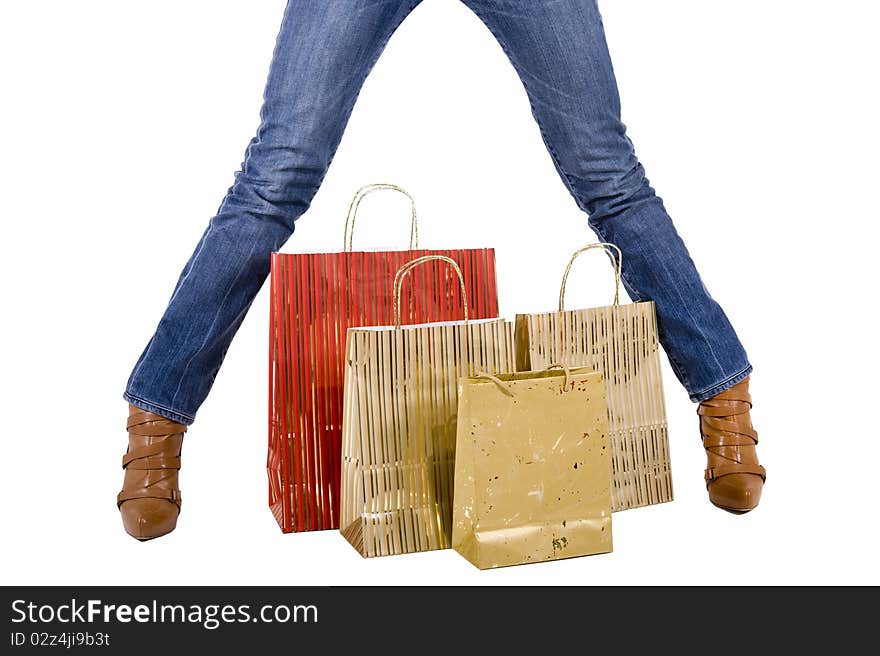 blond woman with shopping bags smiling happily. blond woman with shopping bags smiling happily