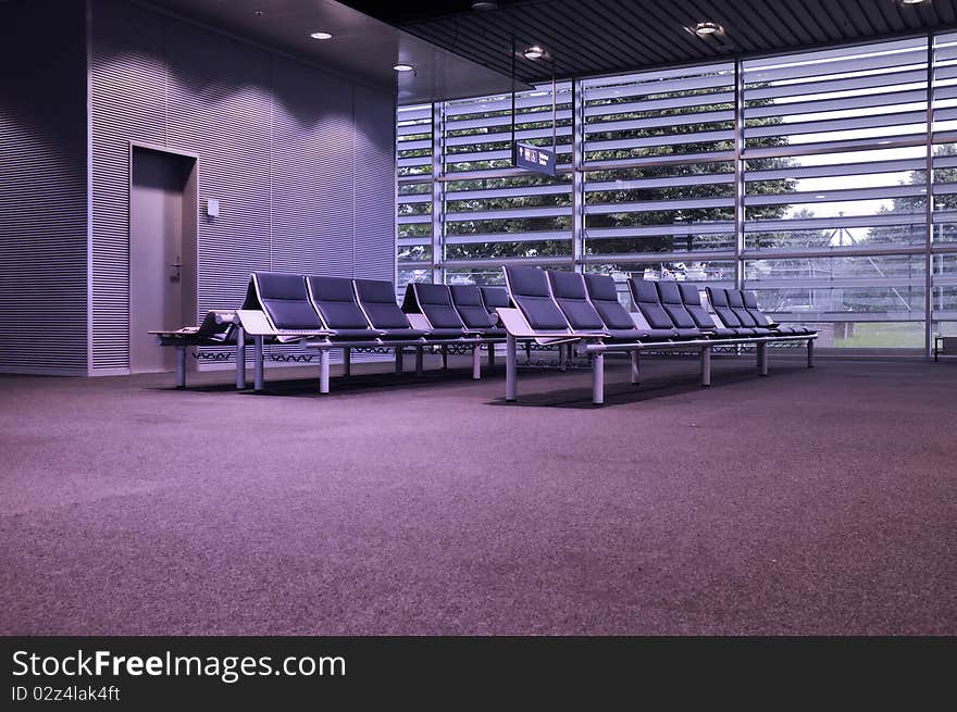 Modern waiting hall with seats row and electrical illumination