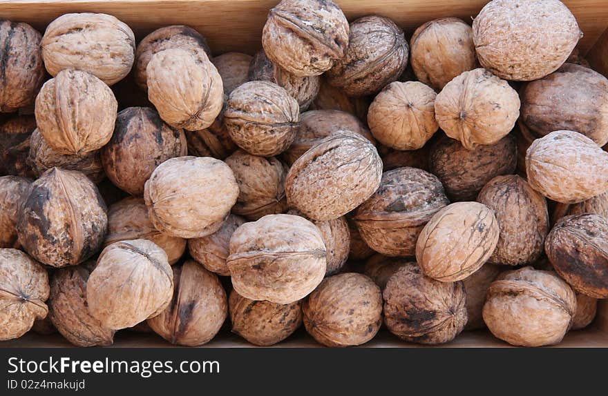 Macro view of walnut on a wooden structure