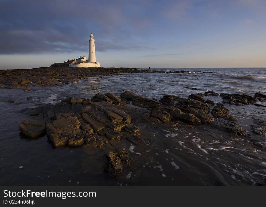 St mary's lighthouse at sunrise with blue sky