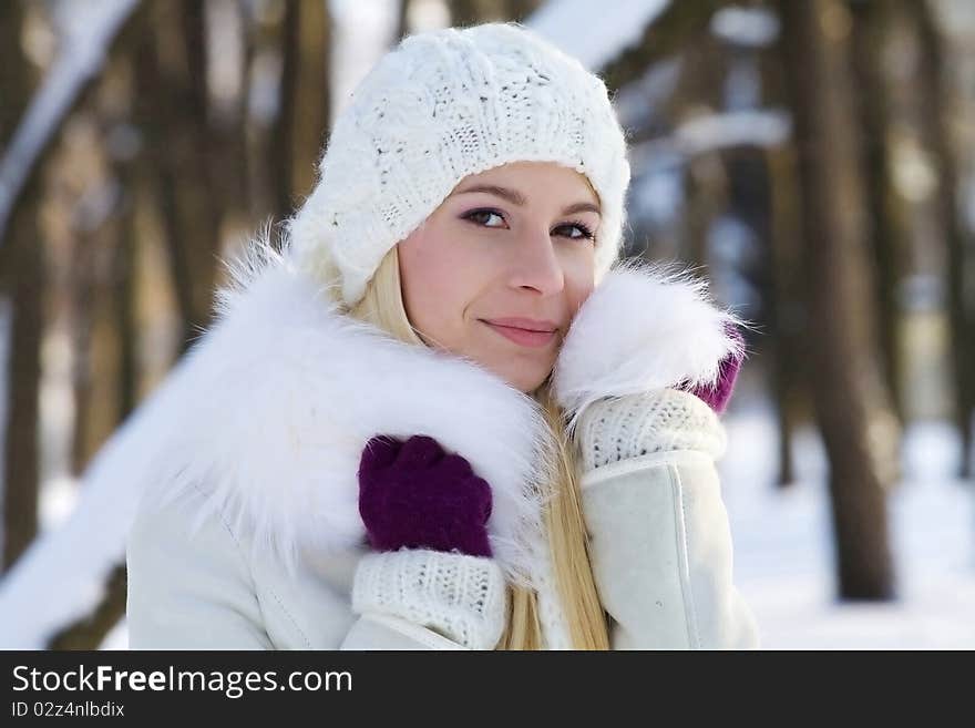 Portrait of beautiful adult girl outdoor in winter