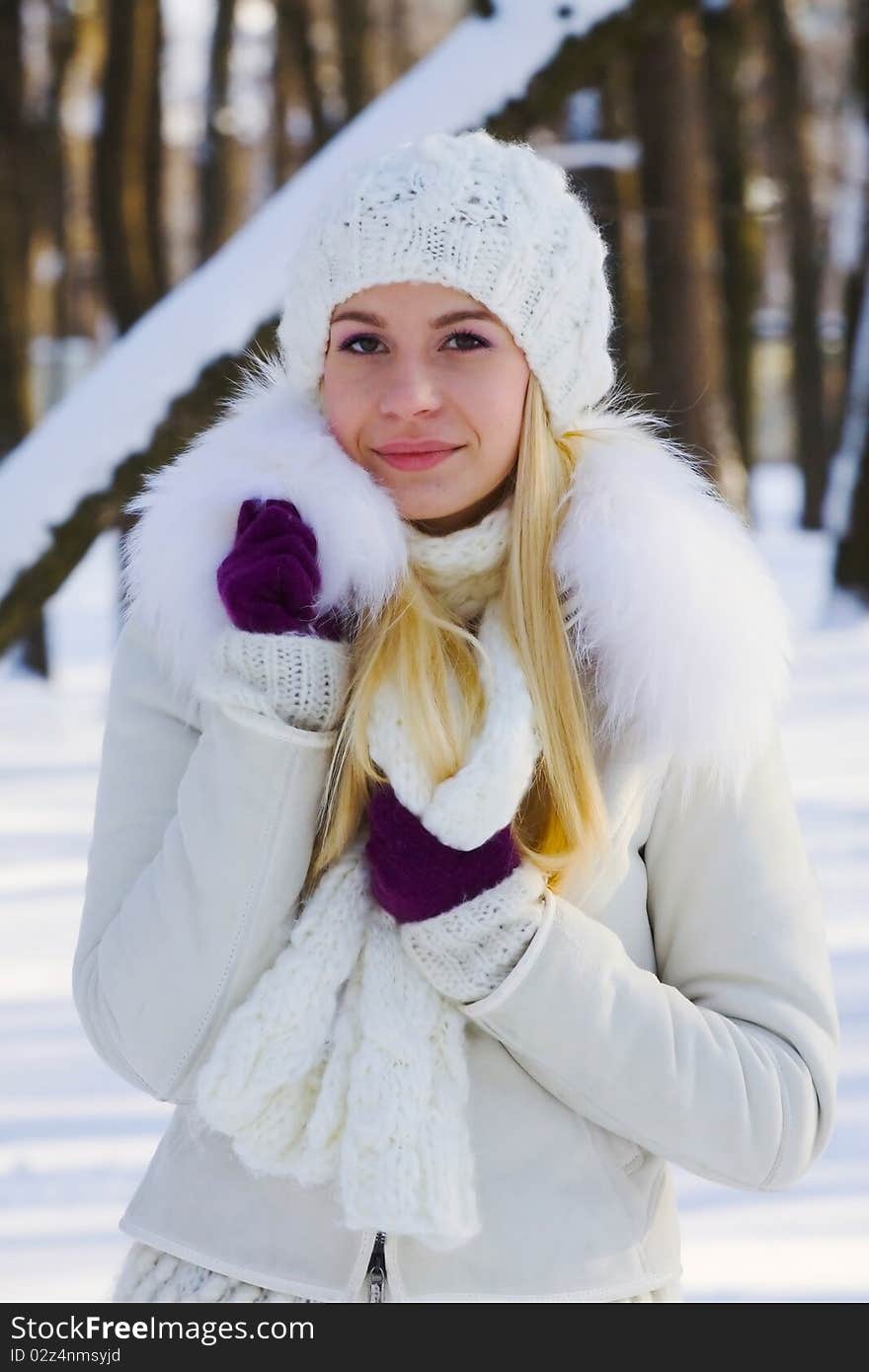 Portrait of beautiful adult girl outdoor in winter