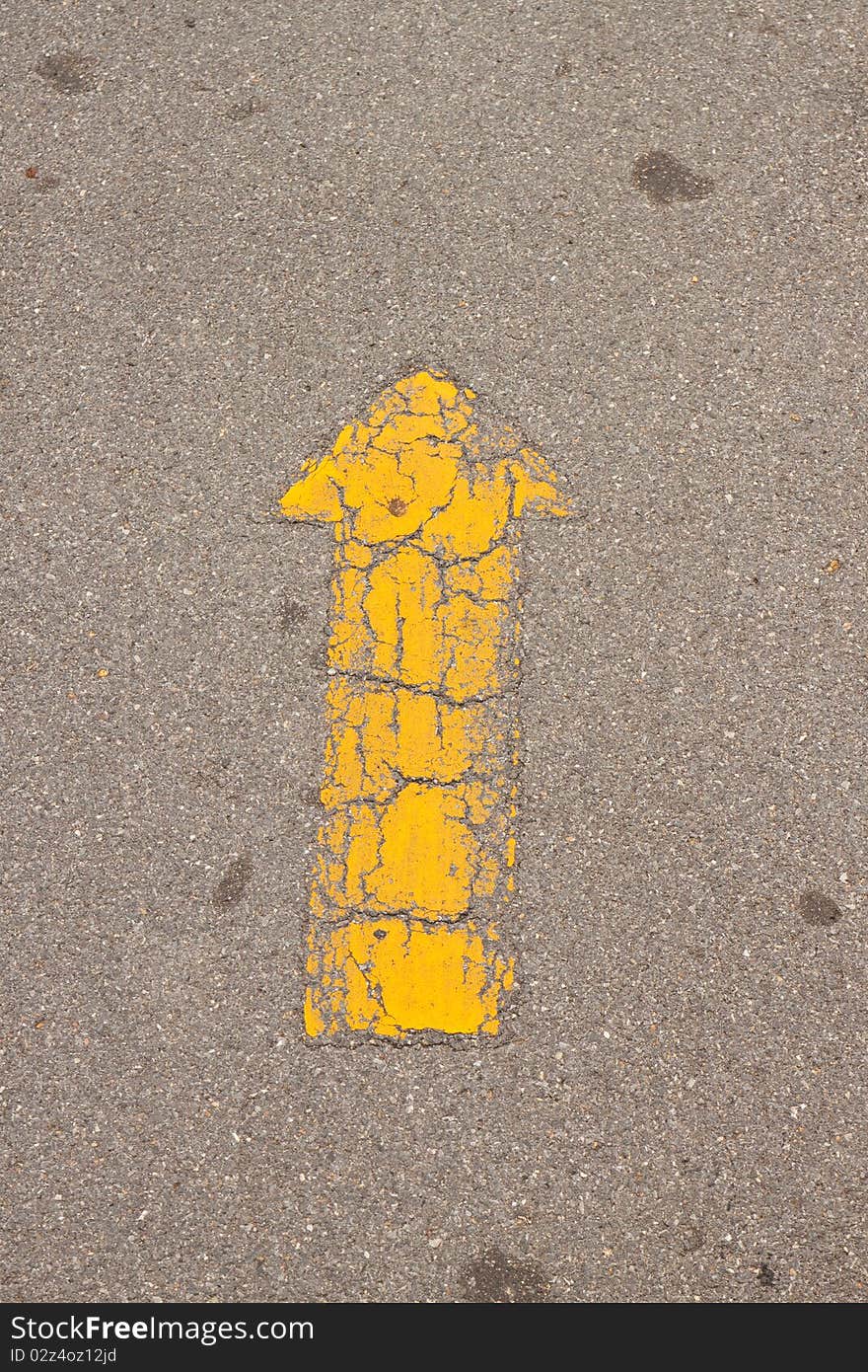 Yellow arrow at the road