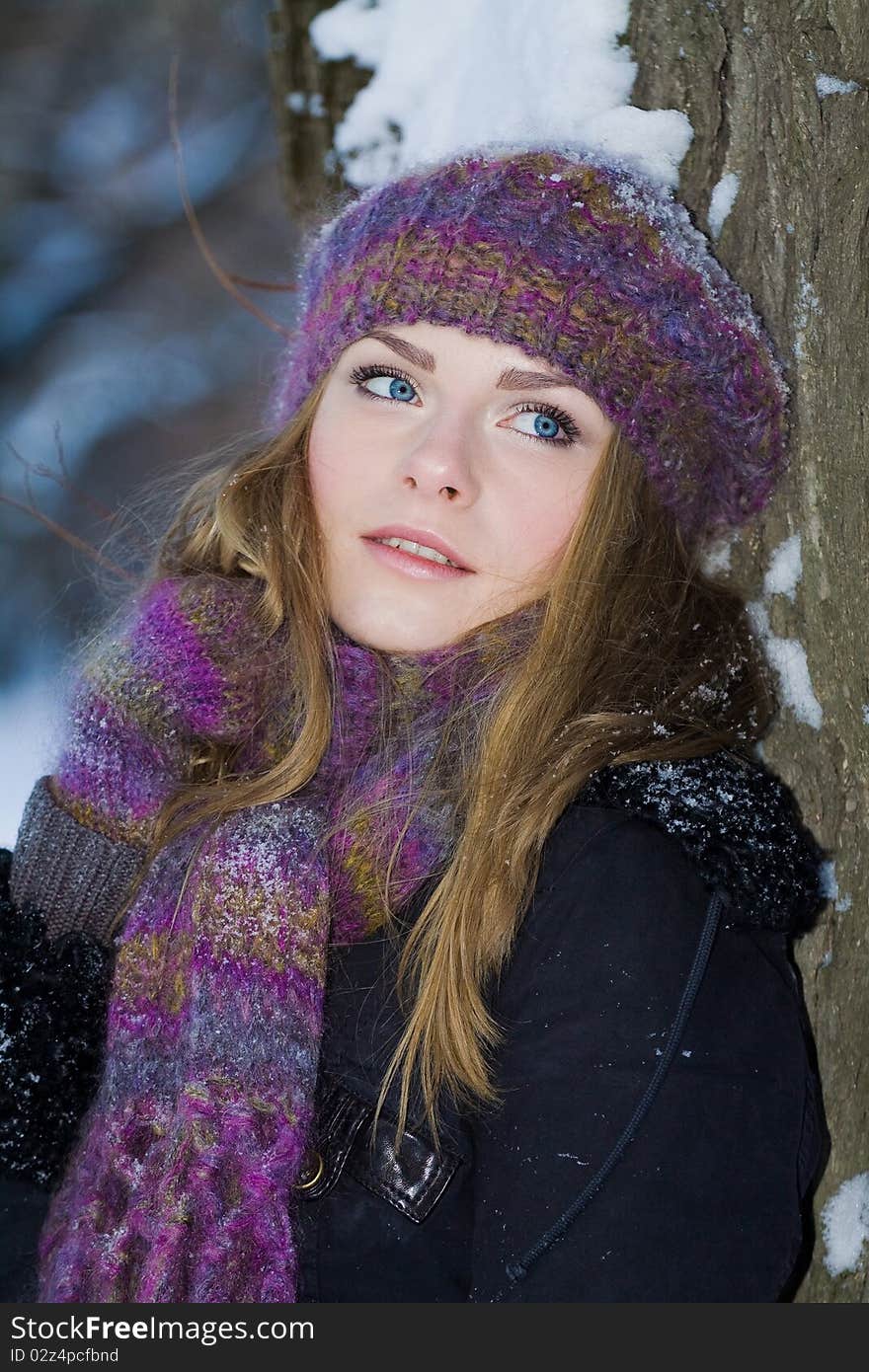 Portrait of beautiful adult girl outdoor in winter