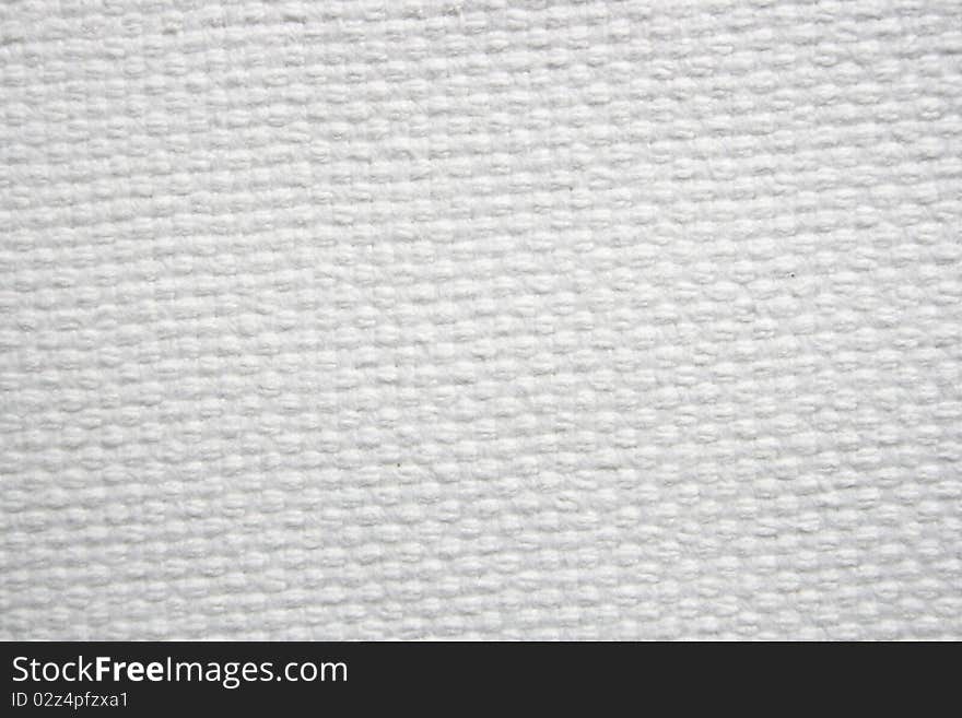 A thick canvas. White color. Very useful for background usage and textural usages.