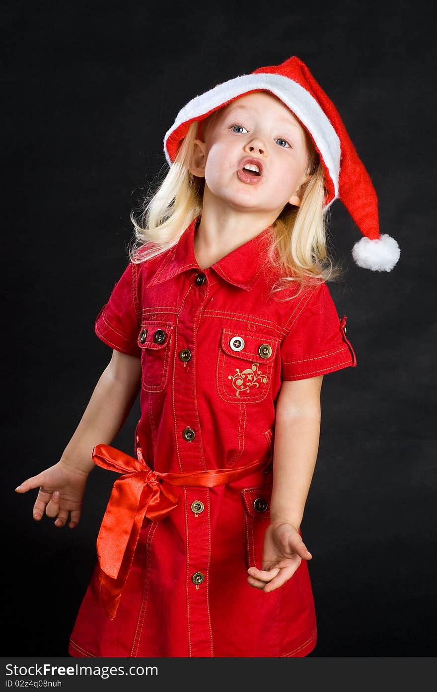 Shouting girl in red dress and santa hat