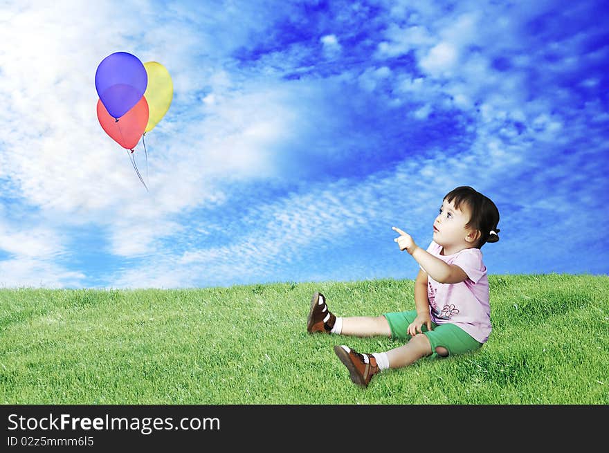 A little girl plays with balloons. A little girl plays with balloons